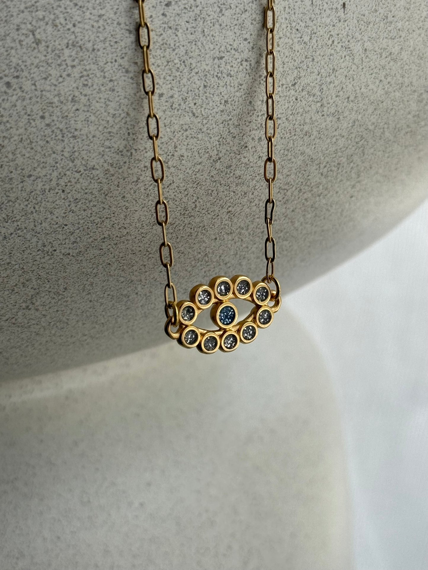 Γυναικείο κολιέ από ατσάλι σε χρυσό με μοτίβο ματιού και ζιργκόν